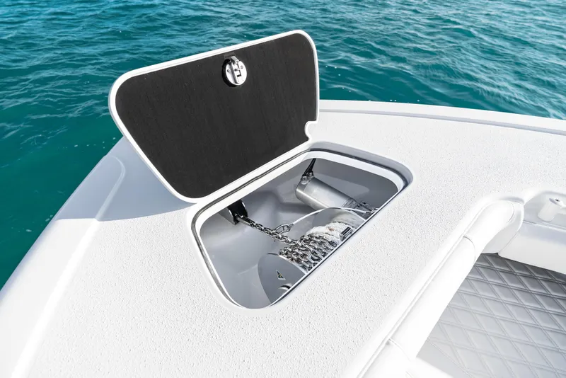 Slide: The Image of Open anchor compartment on 2026 Yellowfin 36 Offshore boat, with ocean background. - 36