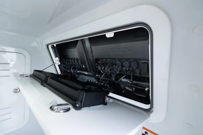 Slide: The Image of 2026 Yellowfin 36 Offshore boat electronics compartment with Garmin equipment. - 39