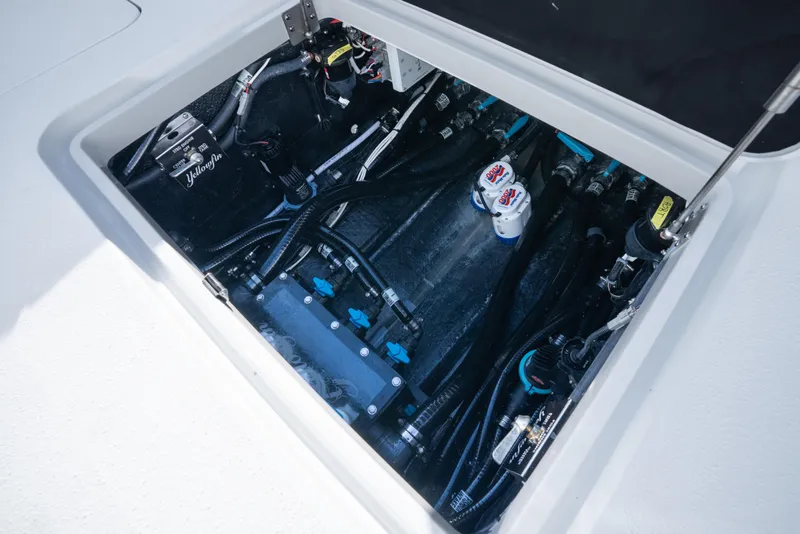 Slide: The Image of 2026 Yellowfin 36 Offshore boat compartment with wiring and components. - 40