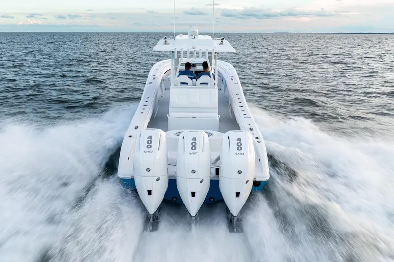 Slide: The Image of 2026 Yellowfin 36 Offshore boat speeding on open water, featuring triple 400 V10 engines. - 7