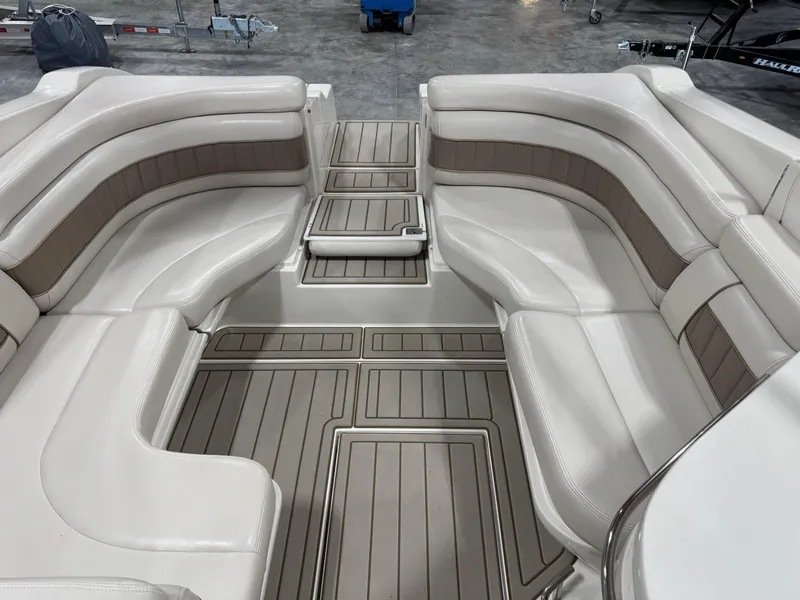 Slide: The Image of Interior of a 2000 Regal 2800 LSR boat with beige seating and flooring. - 10