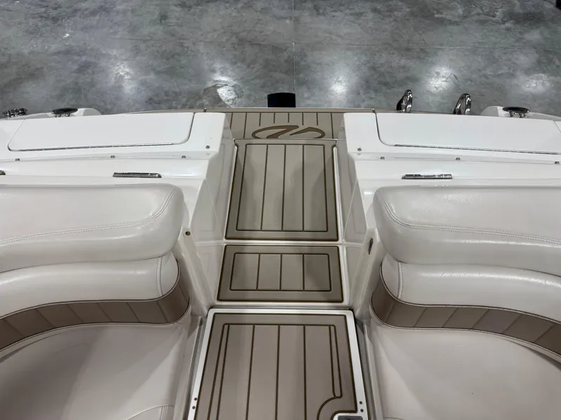 Slide: The Image of Interior view of a 2000 Regal 2800 LSR boat with white seating and deck. - 11