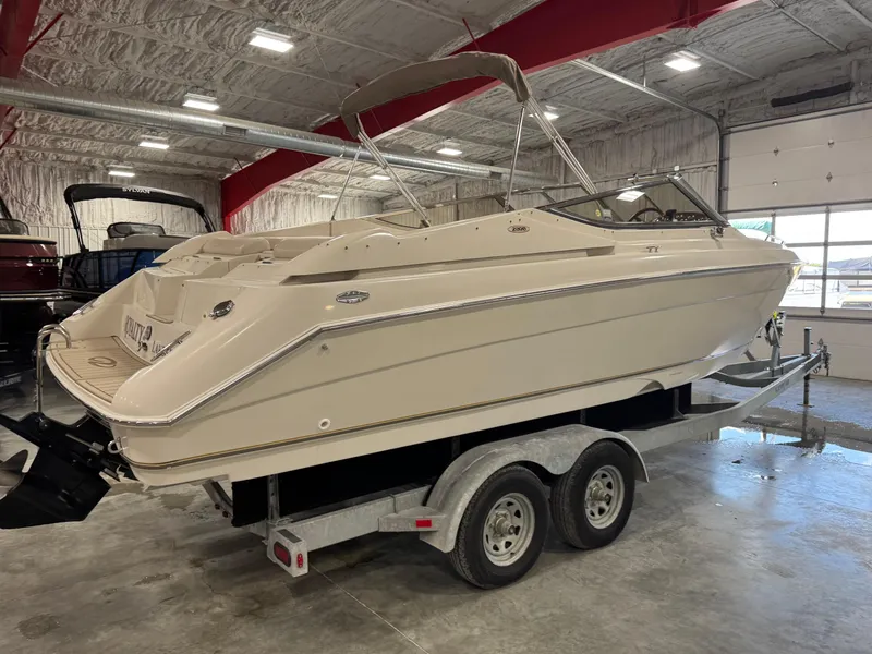 Slide: The Image of 2000 Regal 2800 LSR boat on trailer in indoor storage facility. - 4