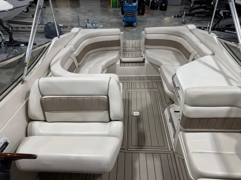 Slide: The Image of Interior of a 2000 Regal 2800 LSR boat with beige seating and flooring. - 6