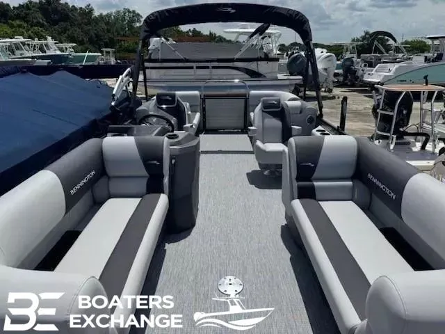 Slide: The Image of Bennington 22SSRSE 2026 pontoon boat with gray seating at the marina. - 11
