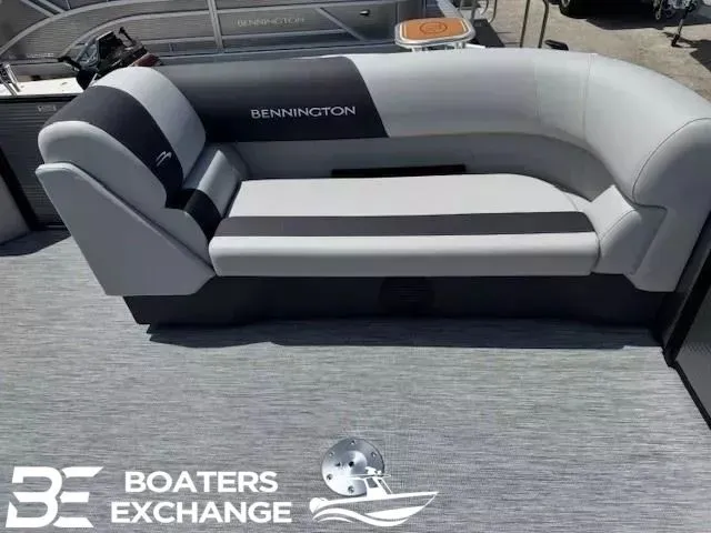 Slide: The Image of Bennington 22SSRSE 2026 pontoon boat seating on gray carpet flooring. - 12