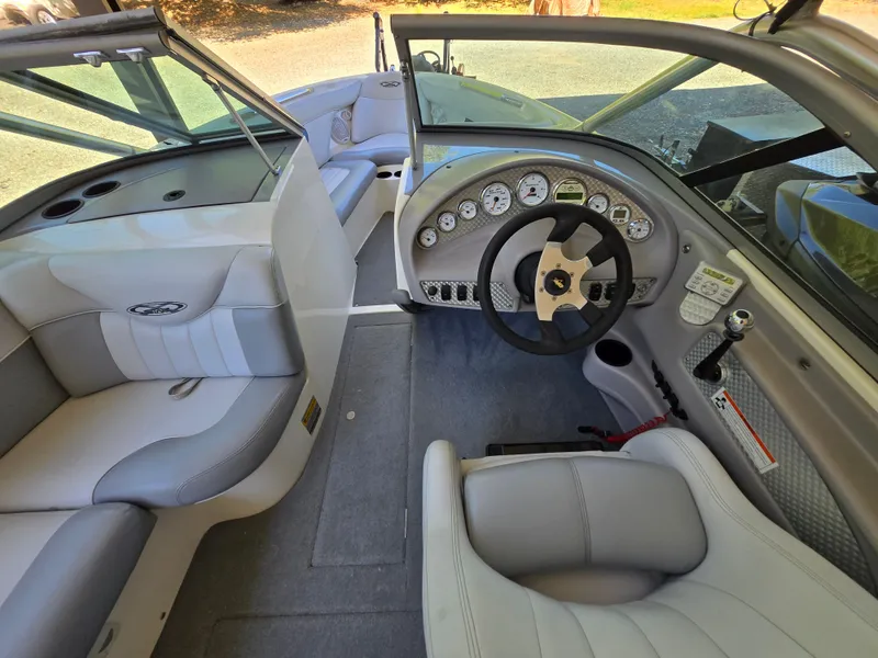 Slide: The Image of 2002 MasterCraft XStar boat interior with steering wheel and seating. - 3