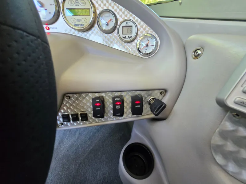 Slide: The Image of Dashboard of a 2002 MasterCraft XStar boat with gauges and controls. - 6