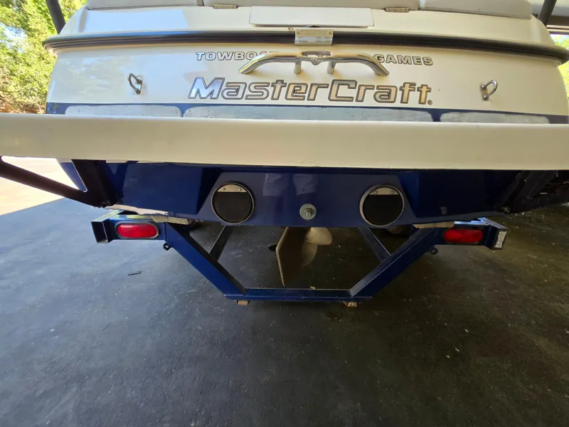 Slide: The Image of 2002 MasterCraft XStar boat rear view with trailer and propeller. - 8