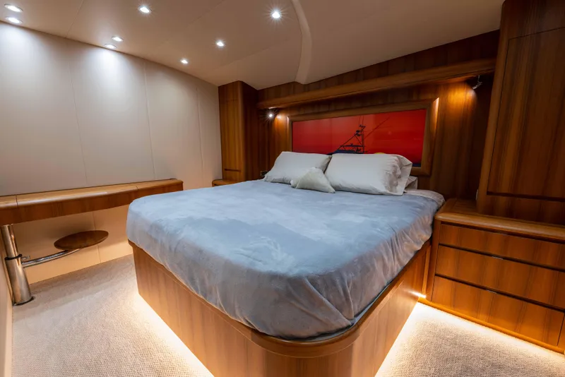Slide: The Image of Luxurious bedroom interior of 2025 Garlington 71' Flybridge yacht with modern wood finishes. - 14
