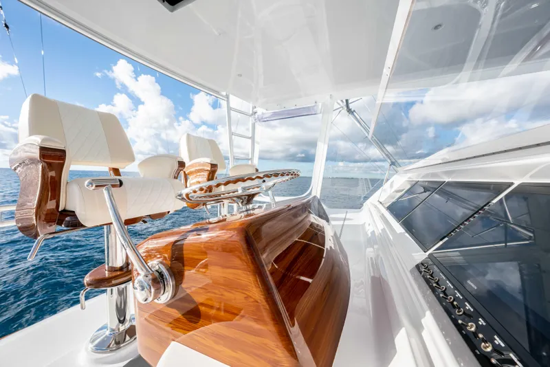 Slide: The Image of Luxurious 2025 Garlington 71' Flybridge yacht interior with elegant seating and ocean view. - 22