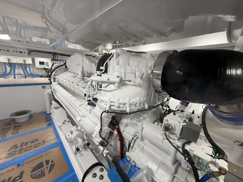 Slide: The Image of Engine room of 2025 Garlington 71' Flybridge yacht, showcasing advanced machinery and components. - 26