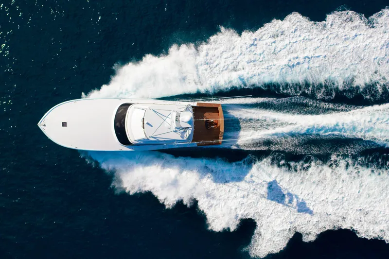 Slide: The Image of Aerial view of 2025 Garlington 71' Flybridge yacht cruising on open water. - 28