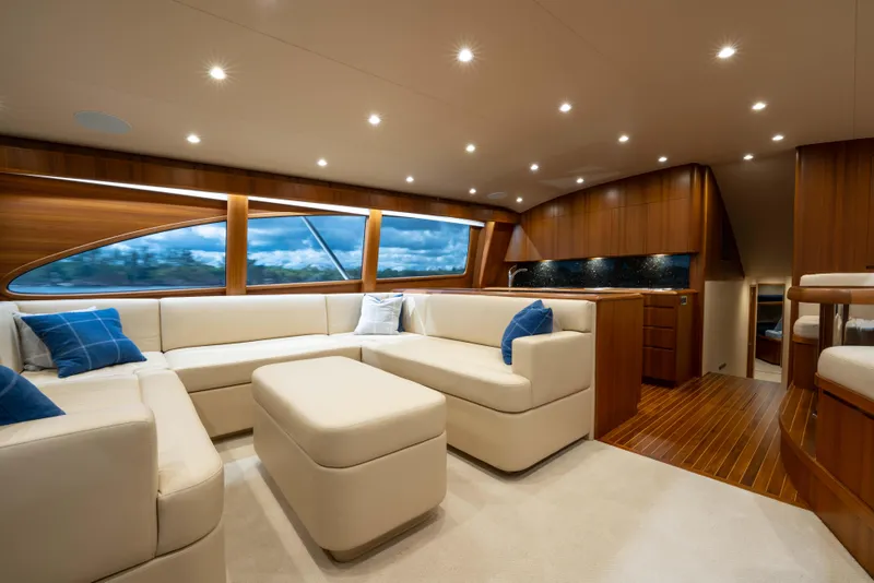 Slide: The Image of Luxurious interior of 2025 Garlington 71' Flybridge yacht with elegant seating and wood finishes. - 9