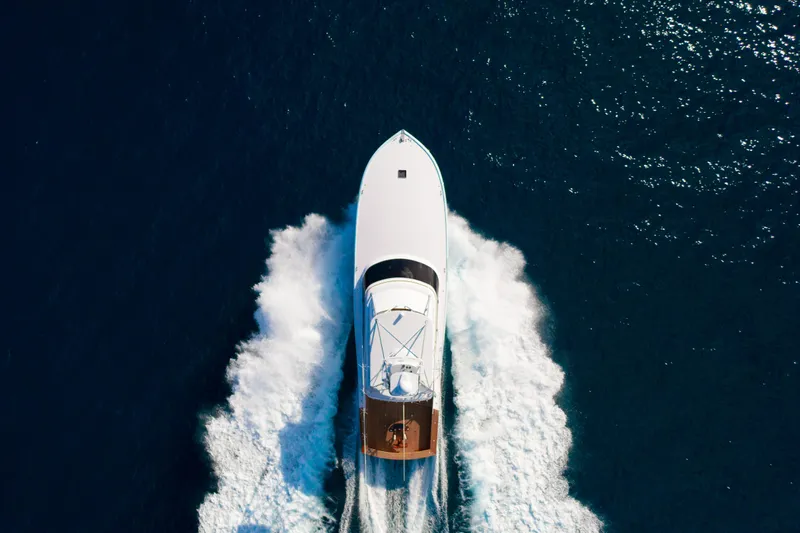 Slide: The Image of Aerial view of 2025 Garlington 71' Flybridge yacht cruising on open water. - 6