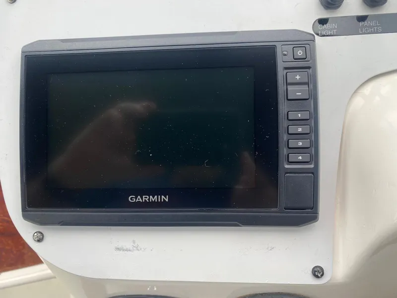 Slide: The Image of Garmin navigation system on 2001 Wellcraft 45 Excalibur boat dashboard. - 10