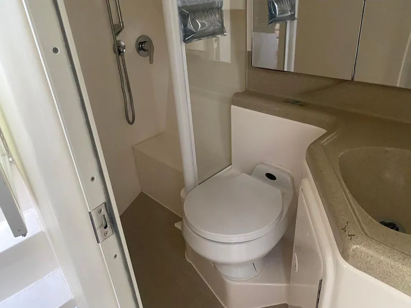 Slide: The Image of Bathroom of 2001 Wellcraft 45 Excalibur yacht with shower, toilet, and sink. - 12