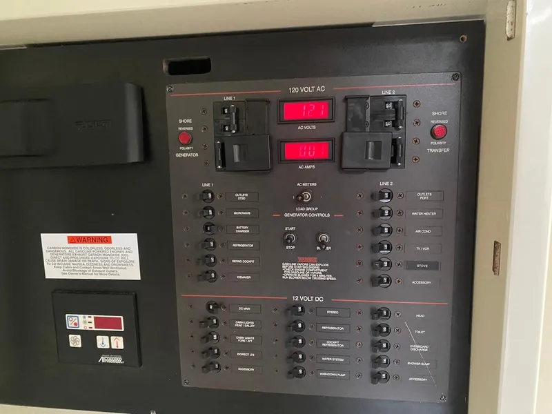 Slide: The Image of Electrical control panel on a 2001 Wellcraft 45 Excalibur boat. - 16
