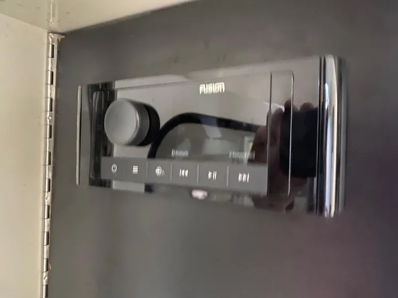 Slide: The Image of Fusion audio system on a 2001 Wellcraft 45 Excalibur boat dashboard. - 17