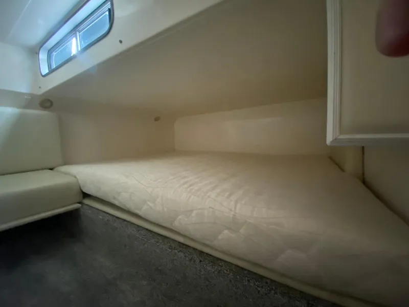 Slide: The Image of Interior cabin of 2001 Wellcraft 45 Excalibur with bed and window. - 23