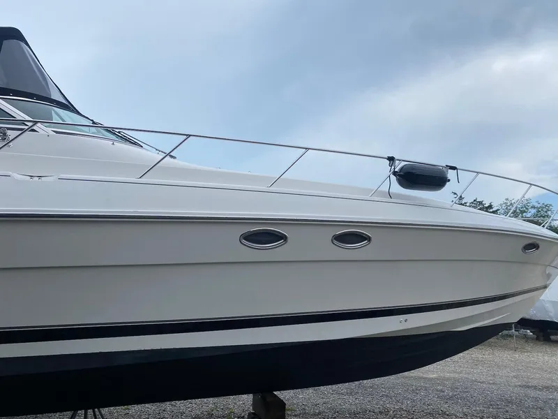 Slide: The Image of 2001 Wellcraft 45 Excalibur boat with sleek white hull and modern design. - 3