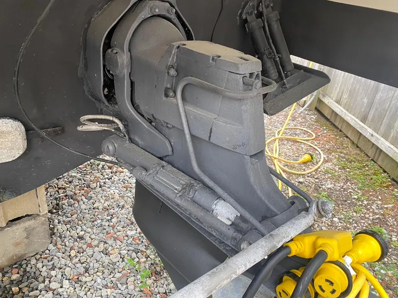 Slide: The Image of Close-up of a 2001 Wellcraft 45 Excalibur boat's engine component on gravel. - 5