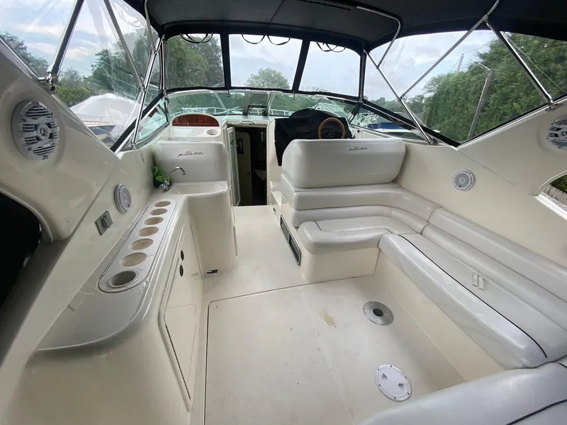 Slide: The Image of 2001 Wellcraft 45 Excalibur boat interior with seating and cup holders. - 8