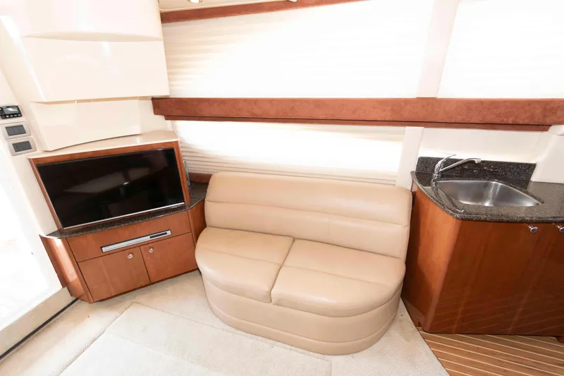 Slide: The Image of Interior of 2006 Meridian 341 Sedan with beige sofa, TV, and kitchenette. - 16