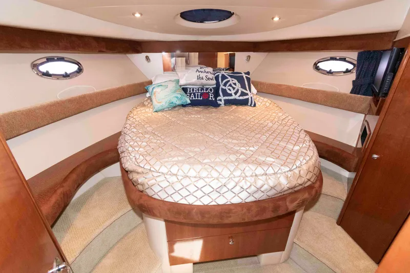 Slide: The Image of Luxurious cabin interior of a 2006 Meridian 341 Sedan yacht with plush bedding. - 19