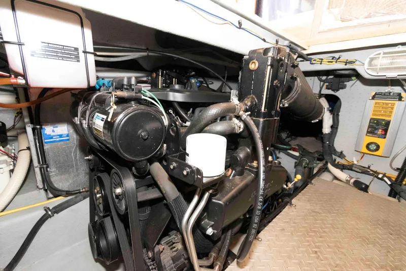 Slide: The Image of Engine room of a 2006 Meridian 341 Sedan boat, showcasing mechanical components. - 24