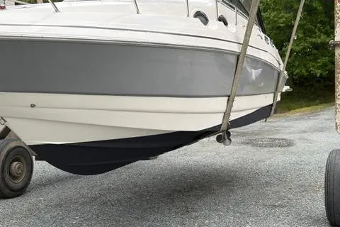 Slide: The Image of 2010 Glastron GS 289 boat on trailer, side view, gray and white hull. - 20