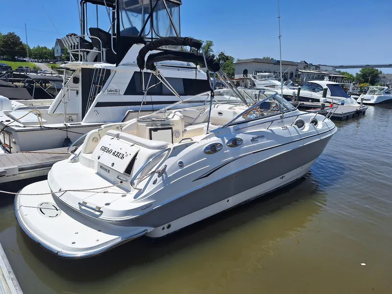 Slide: The Image of 2010 Glastron GS 289 boat docked at marina, sunny day, calm waters. - 3
