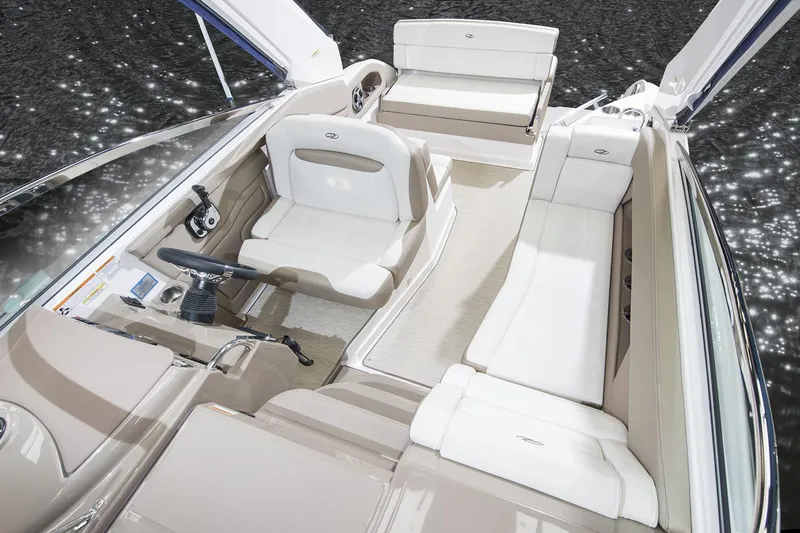 Slide: The Image of 2016 Regal 28 Express boat interior with white and beige seating. - 88