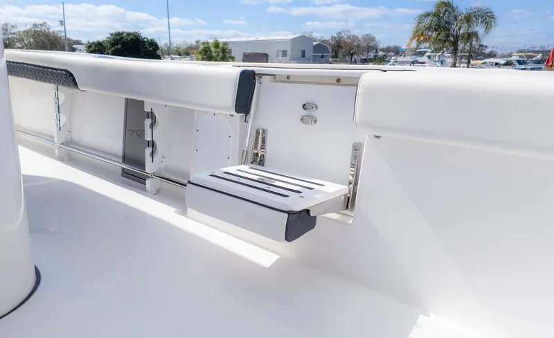 Slide: The Image of 2025 Tidewater 3100 CB boat interior with foldable step and sleek white design. - 12