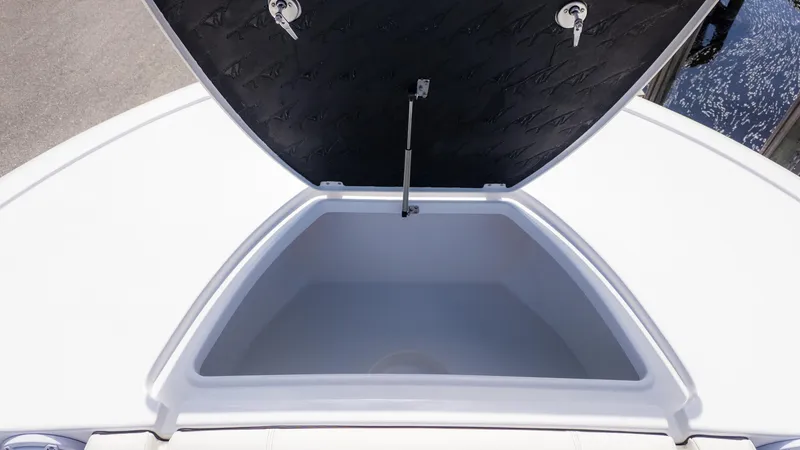 Slide: The Image of Open storage compartment on 2025 Tidewater 3100 CB boat, showcasing spacious interior. - 24
