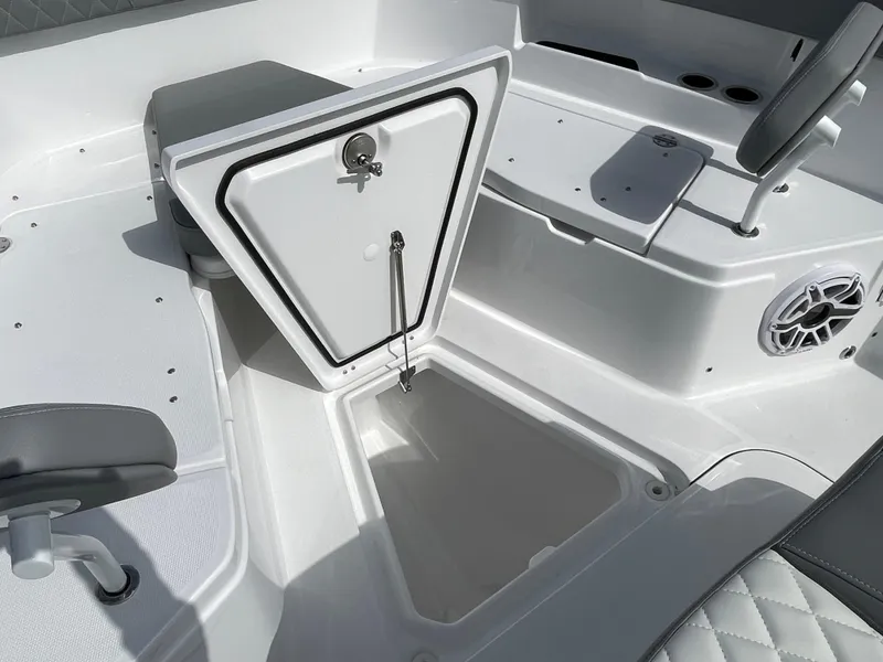 Slide: The Image of Open storage compartment on 2026 Everglades 375cc boat interior. - 10