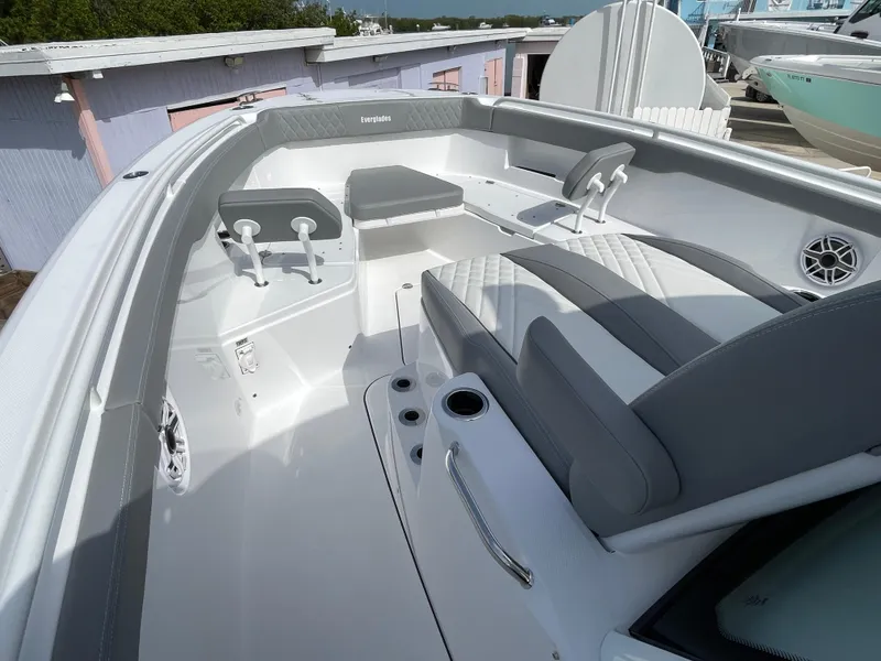 Slide: The Image of 2026 Everglades 375cc boat interior with gray seating and modern design. - 11