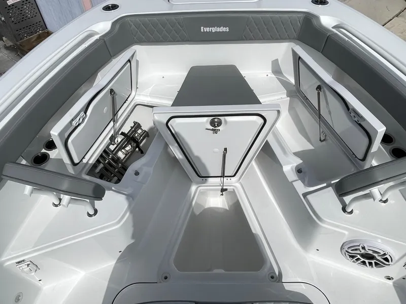 Slide: The Image of 2026 Everglades 375cc boat interior with open storage compartments and sleek design. - 16
