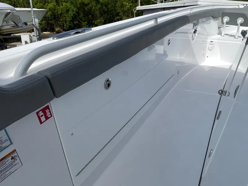 Slide: The Image of 2026 Everglades 375cc boat interior with sleek white design and safety features. - 18