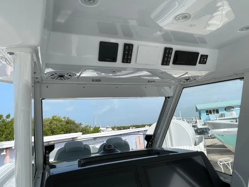 Slide: The Image of Interior view of 2026 Everglades 375cc boat cockpit with control panels and seating. - 21