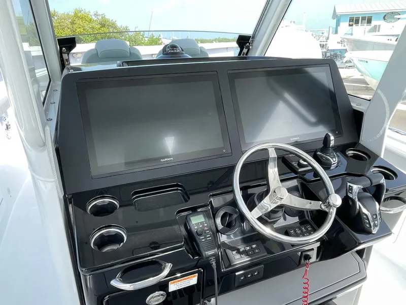 Slide: The Image of Helm of 2026 Everglades 375cc boat with dual screens and modern controls. - 22