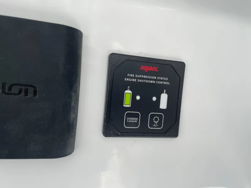 Slide: The Image of Control panel for Fireboy fire suppression system on Everglades 375cc, 2026 model. - 26