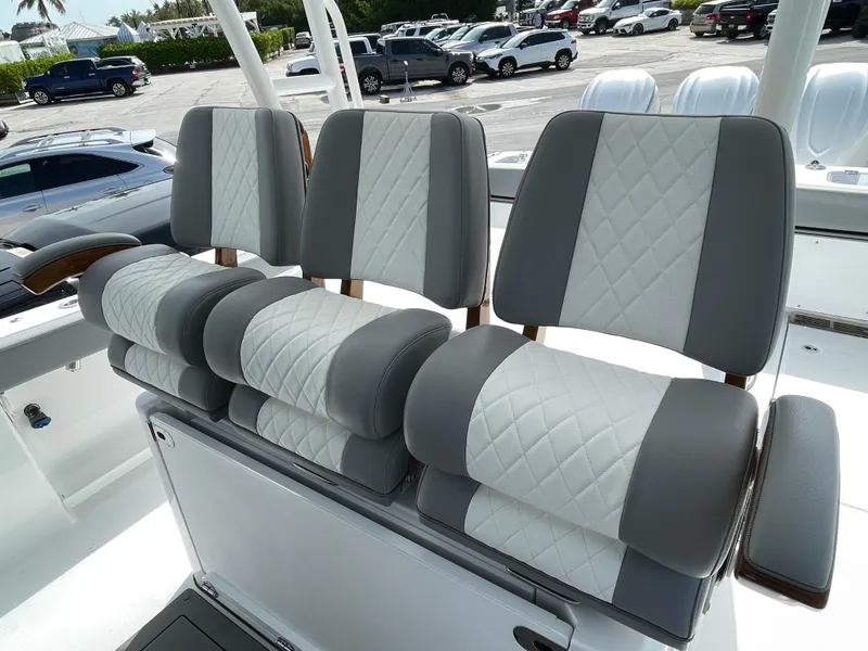 Slide: The Image of Luxury seating on 2026 Everglades 375cc boat, featuring gray and white quilted upholstery. - 30