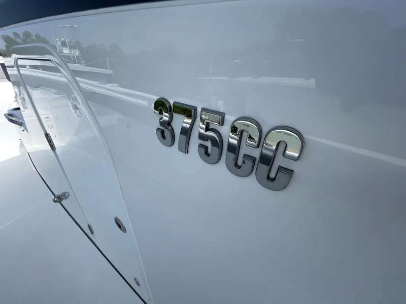 Slide: The Image of Everglades 375cc 2026 model boat with sleek design and chrome lettering. - 31