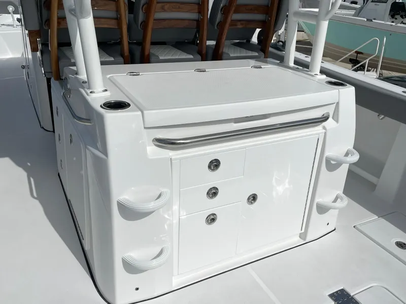 Slide: The Image of 2026 Everglades 375cc boat interior with storage compartments and seating. - 45