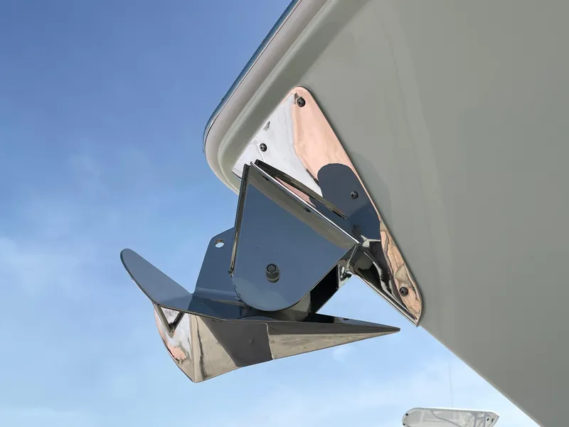 Slide: The Image of Shiny anchor on Everglades 375cc boat, 2026 model, against clear blue sky. - 7
