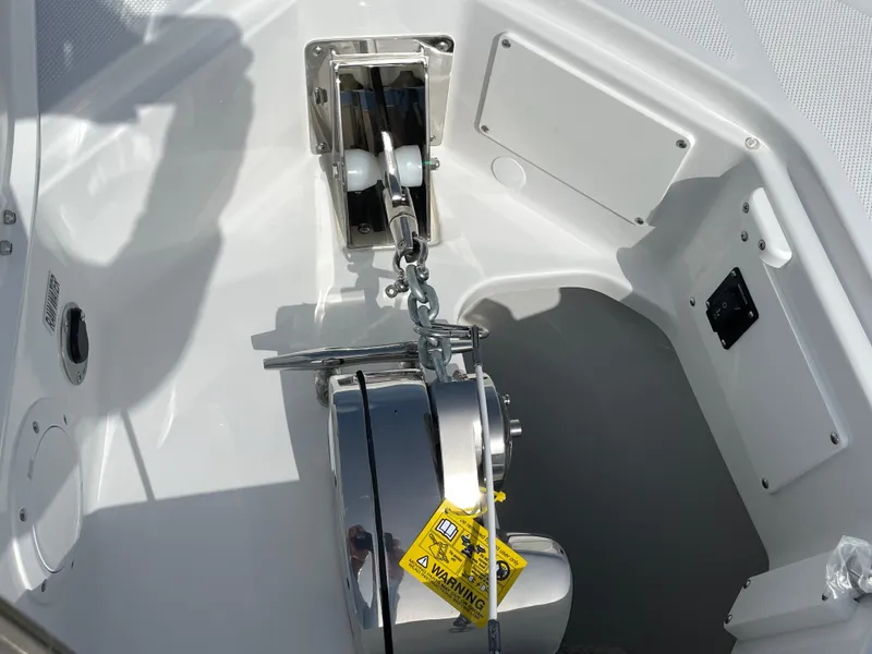 Slide: The Image of Anchor system of 2026 Everglades 375cc boat, featuring a modern design and warning label. - 9