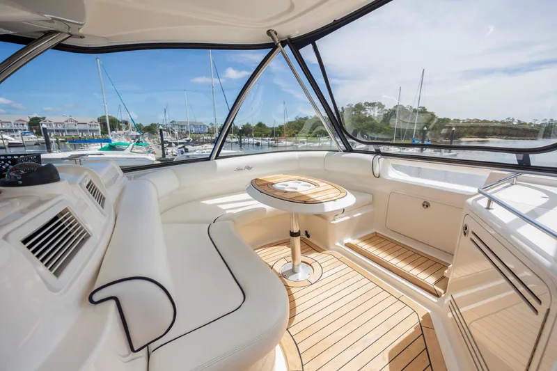 Slide: The Image of Interior of 2008 Sea Ray 58 Sedan Bridge yacht with elegant seating and wooden table. - 21