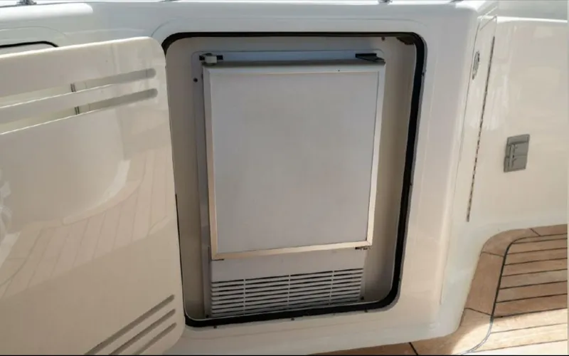 Slide: The Image of Built-in refrigerator on 2008 Sea Ray 58 Sedan Bridge yacht, open door view. - 24