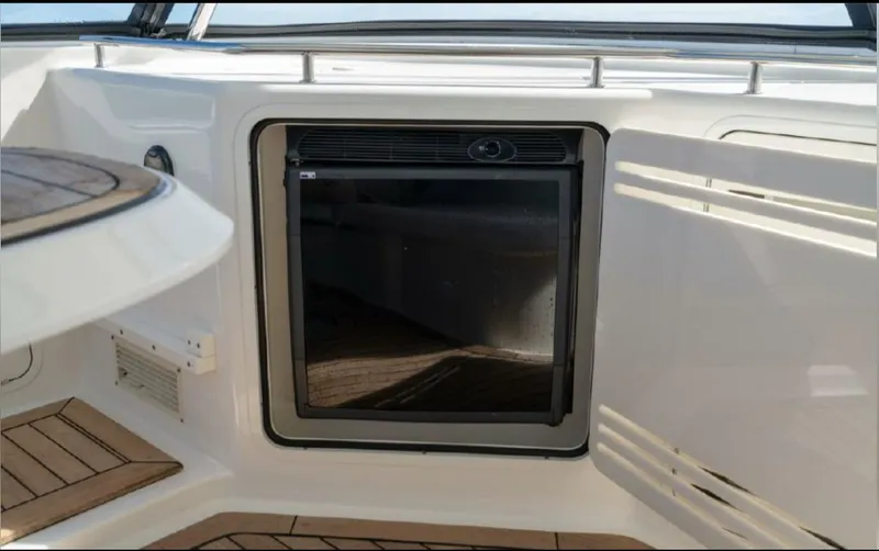 Slide: The Image of 2008 Sea Ray 58 Sedan Bridge yacht with built-in mini fridge on deck. - 26